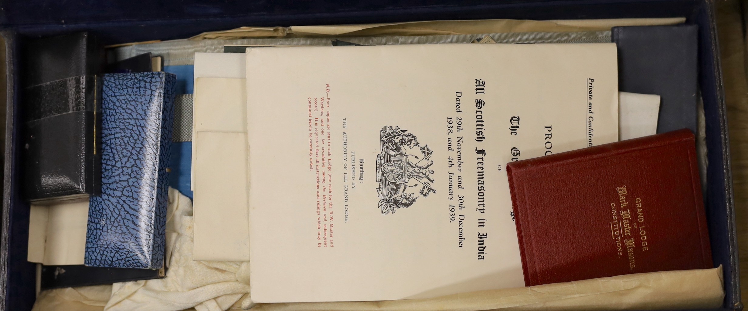 A collection of Masonic medals, cuffs and ephemera and, a W Masjid-1, Suleman Lodge Banquet menu autographed on the front cover and Proceedings of The Grand Lodge Bombay 1939, together in two suitcases